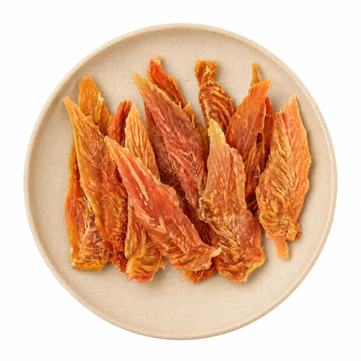 Chicken breast jerky pet treats arranged on a ceramic plate